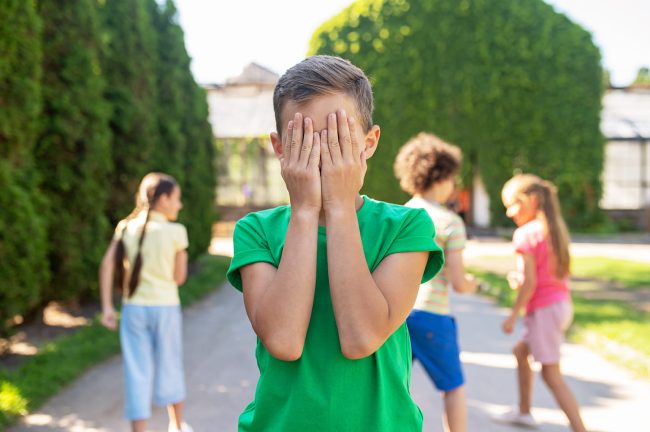 hide-seek-boy-green-tshirt-covering-eyes-with-hands-hiding-children-park-fine-afternoon What Can We Do to End Bullying in School?