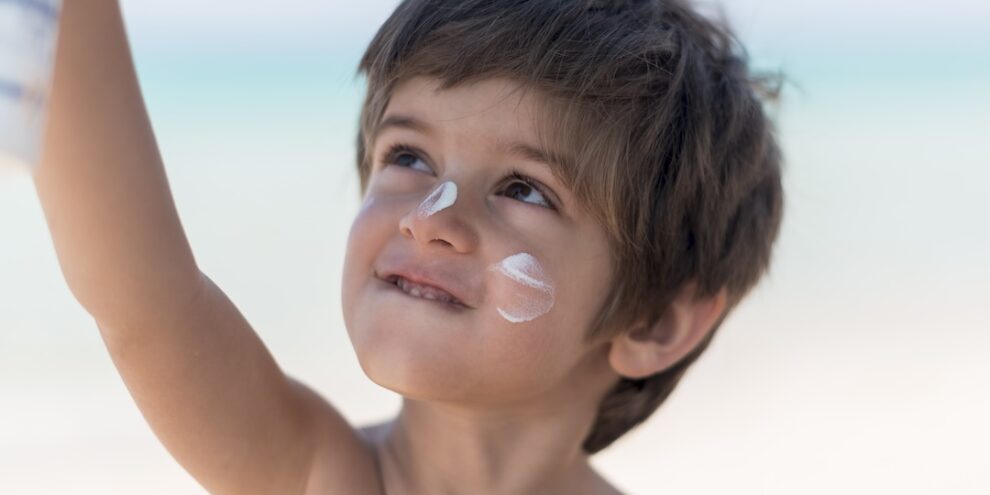 cute-boy-beach-looking-up
